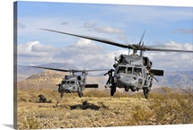 Two HH60 Pavehawk helicopters preparing to land