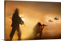 U.S. Special Forces provide security for two incoming UH-60 Black Hawk helicopters