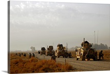US Air Force Security Forces Airmen perform a dry run of roll over drills