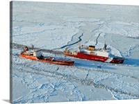 USCG Healy breaks ice around a Russian-flagged tanker south of Nome, Alaska