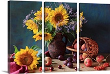 Summer still life with sunflowers, apples, peaches, plums, rowan berries and cherries