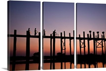 People walking on Ubein Bridge at Sunset, Mandalay, Burma