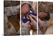 Marines fold an American flag