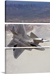 Two F-22 Raptors maneuver while on a training mission over New Mexico