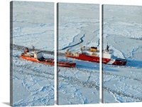 USCG Healy breaks ice around a Russian-flagged tanker south of Nome, Alaska