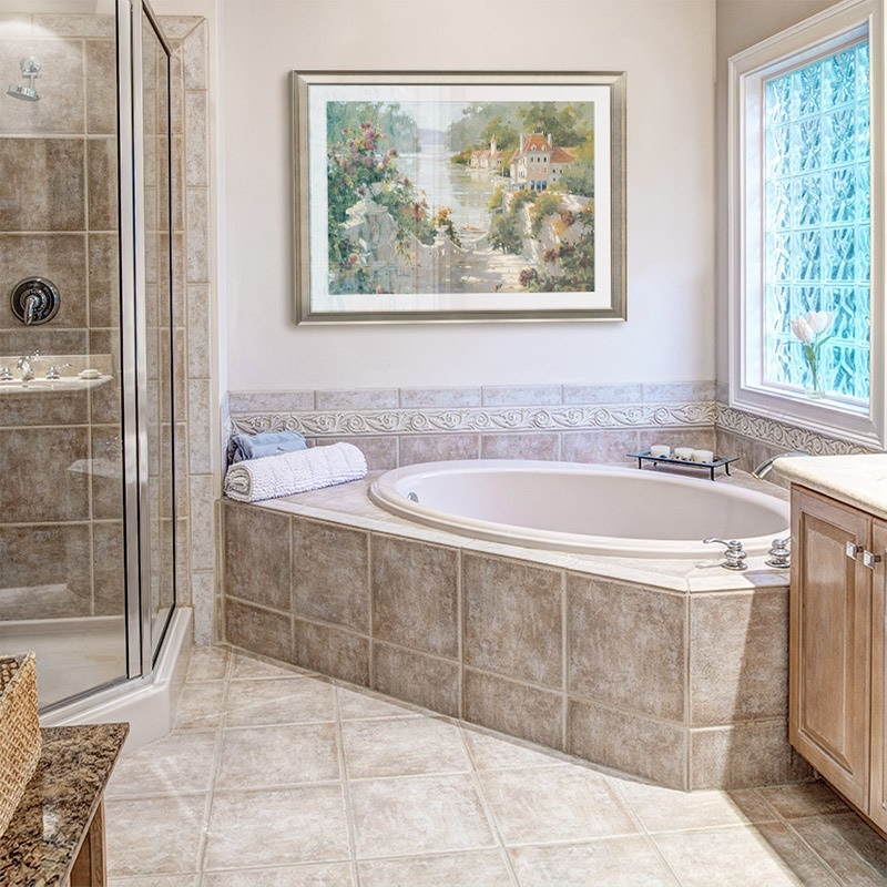 Framed print of a painting of the Italian harbor in a traditional bathroom