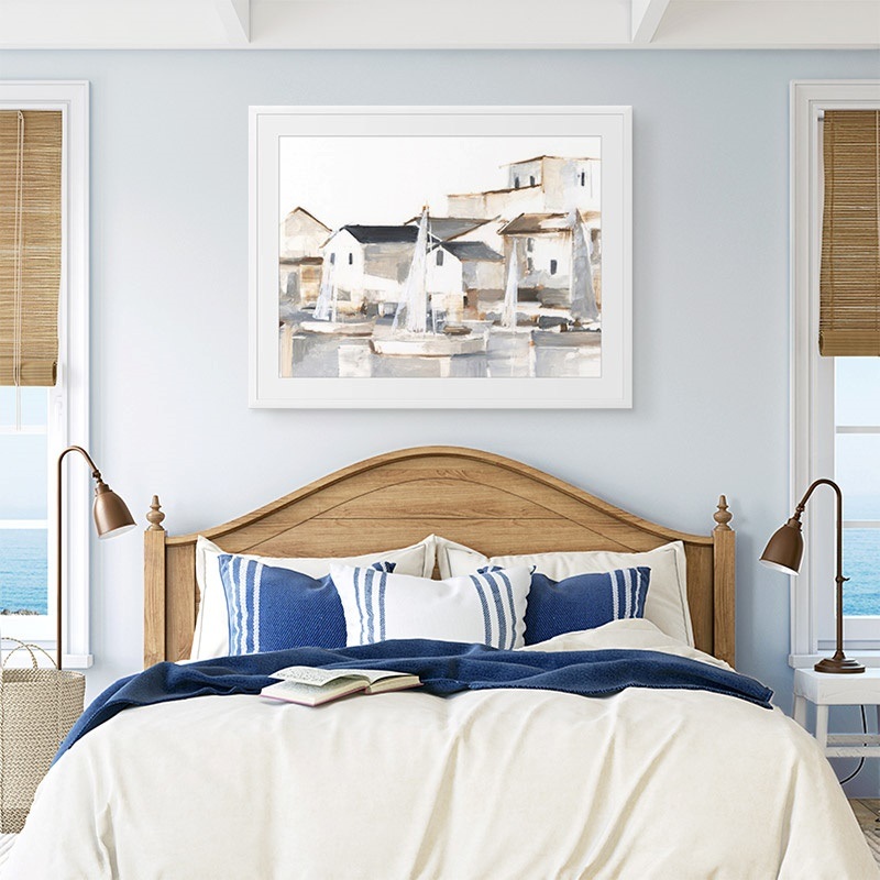 framed print of a painting of a barn hanging in a farmhouse dining room