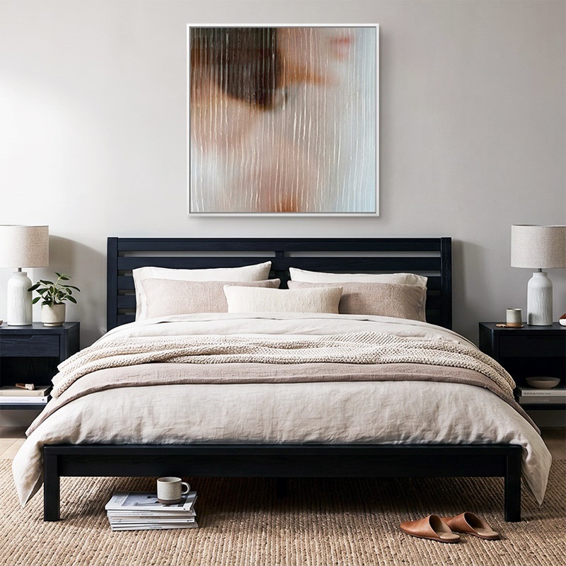 framed canvas print of an abstracted woman in a modern bedroom