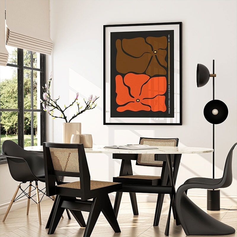 Framed print of mid-century abstract flowers in a dining room