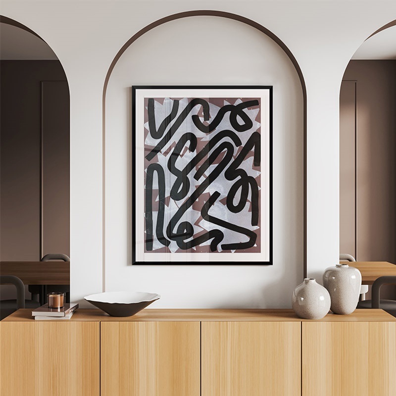 framed print of a neutral minimalist abstract print in a minimal entryway