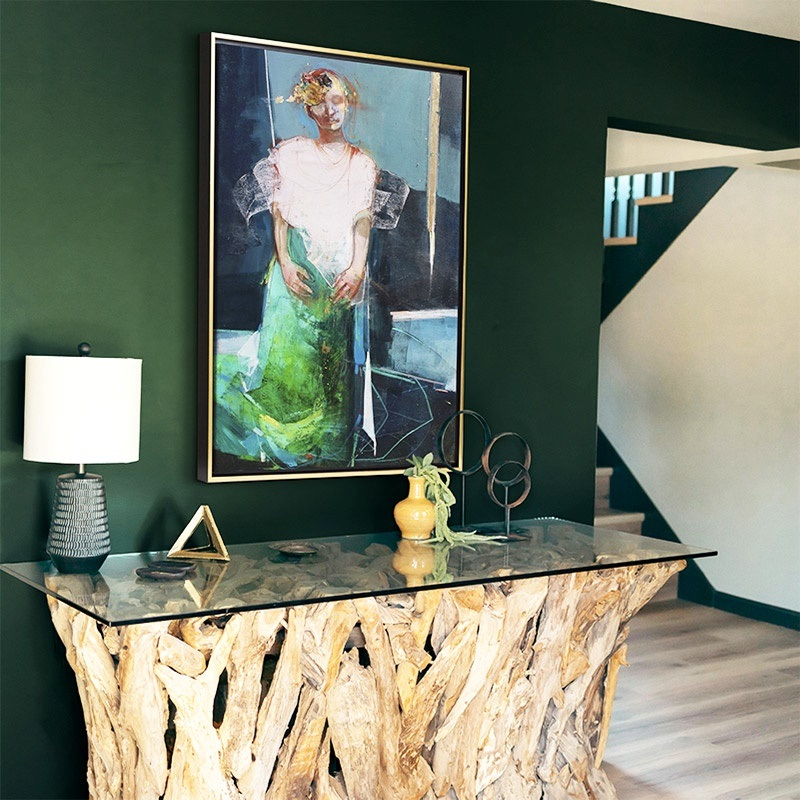 gold floating framed canvas print of a contemporary abstract portrait of a woman in a modern entryway