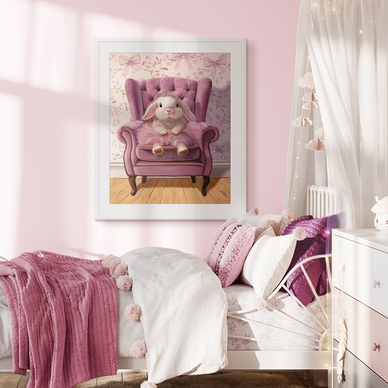 Framed print of a bunny in a tutu on a chair in a girl's bedroom