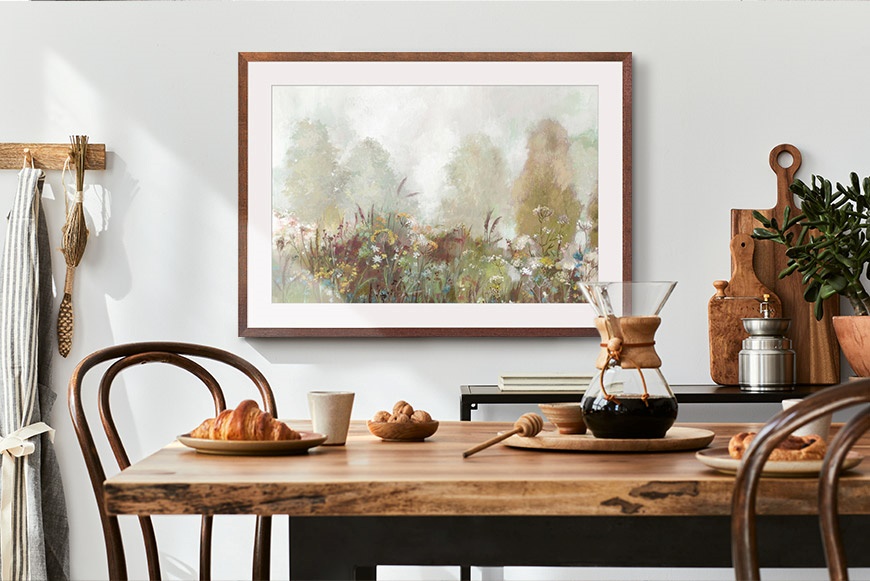 Framed art print of a flower field in a farmhouse dining room