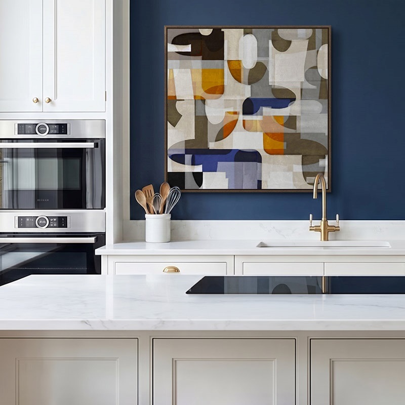 Floating framed canvas print of an abstract painting in a modern kitchen