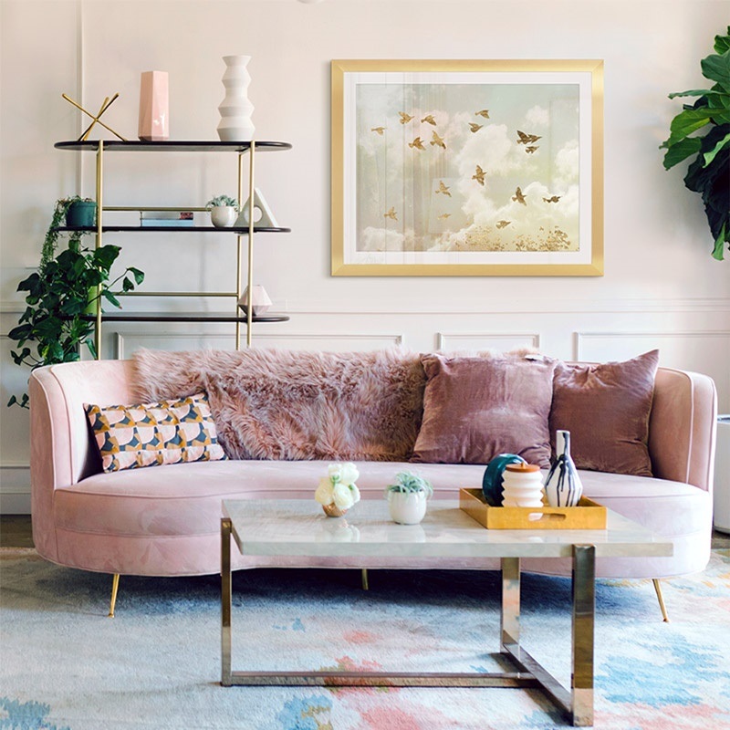 framed print of golden birds in the sky in a glam living room