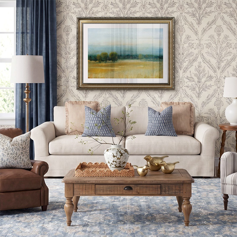 Framed print of a painting of a tranquil landscape in a traditional living room
