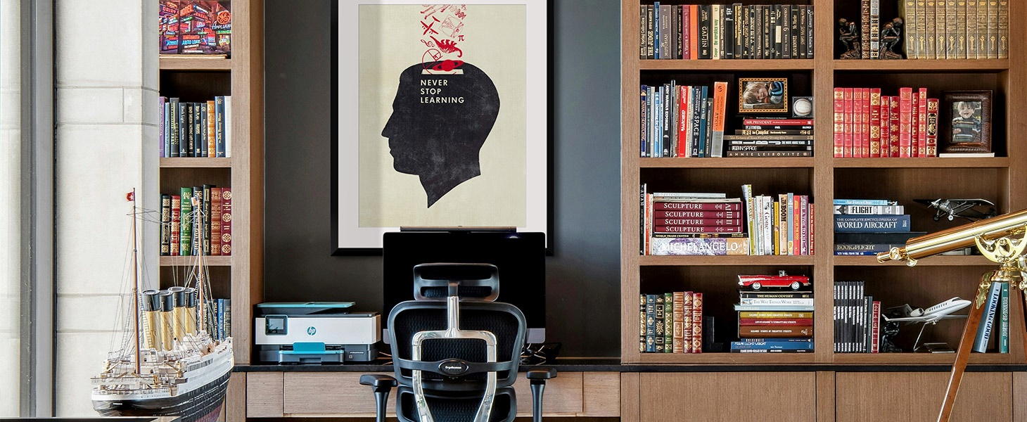 Framed print of an illustration of a man's head in a library