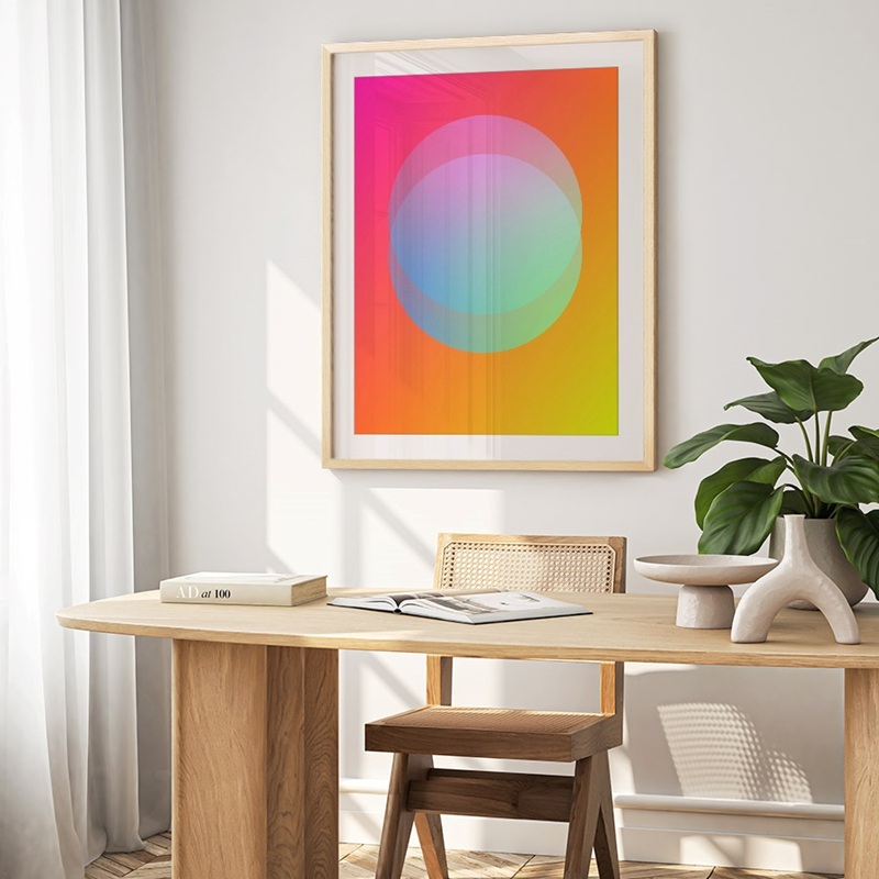 Framed print of bright abstract geometric print in an office