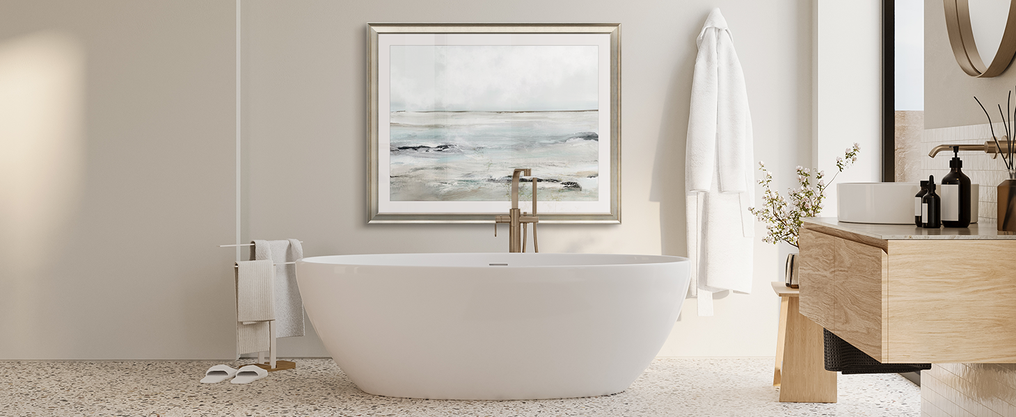 Framed print of a coastal painting in a Mediterranean bathroom