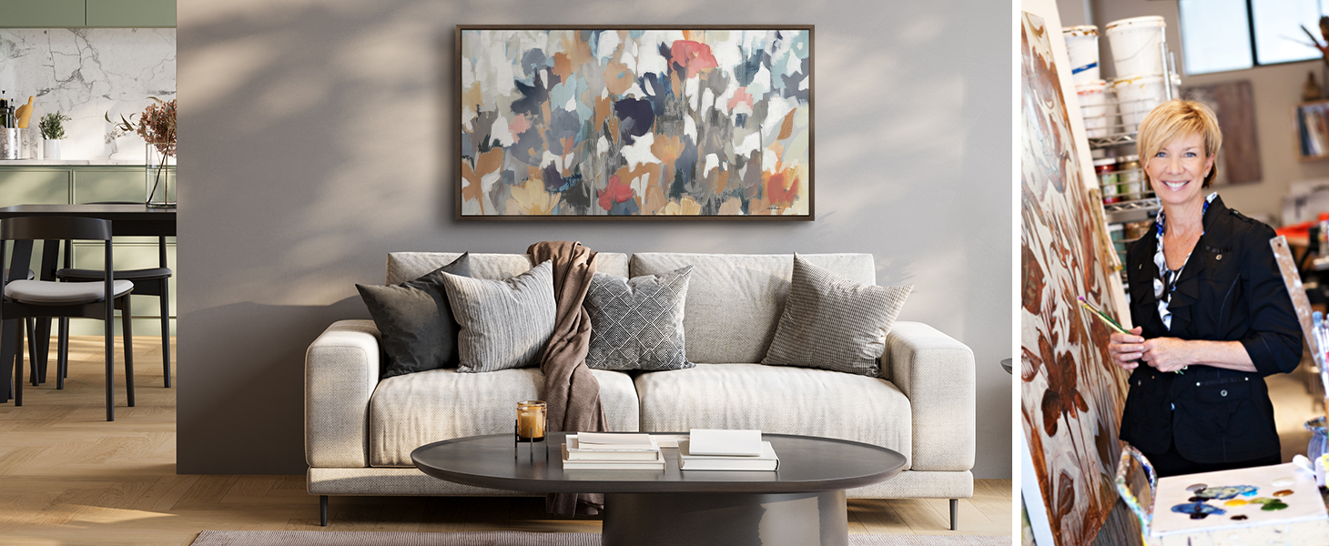Framed canvas print of abstract floral art in a living room next to photo of artist Liz Jardine