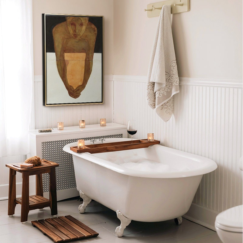 framed canvas print of an abstract portrait painting in a farmhouse bathroom
