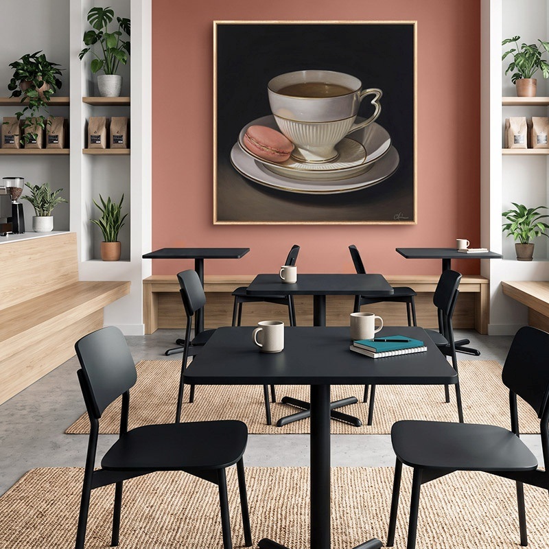 Floating framed canvas print of a photograph of a city skyline in an office