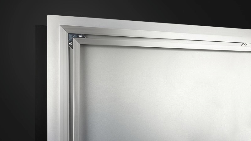 Close up photograph of the back of a metal print