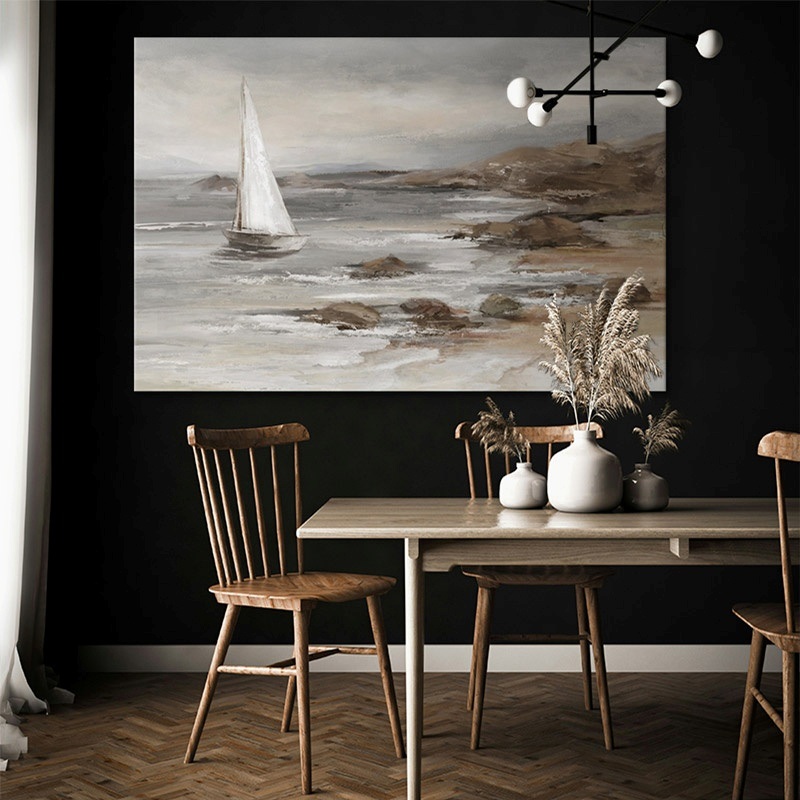 oversized canvas print of a sailboat in the ocean hanging in a dining room