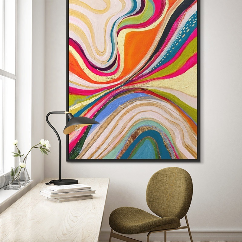 large framed canvas of a vibrant abstract painting in a modern office