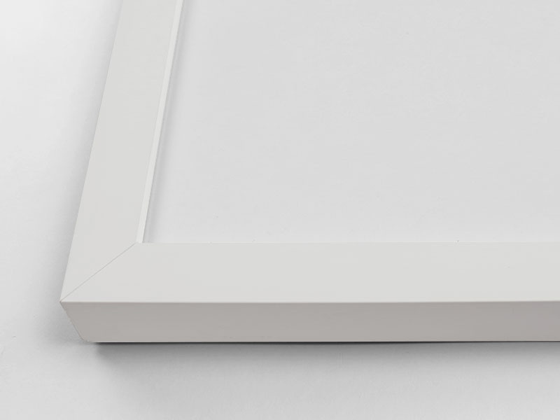 Close-up view of the corner of an art print with a frame