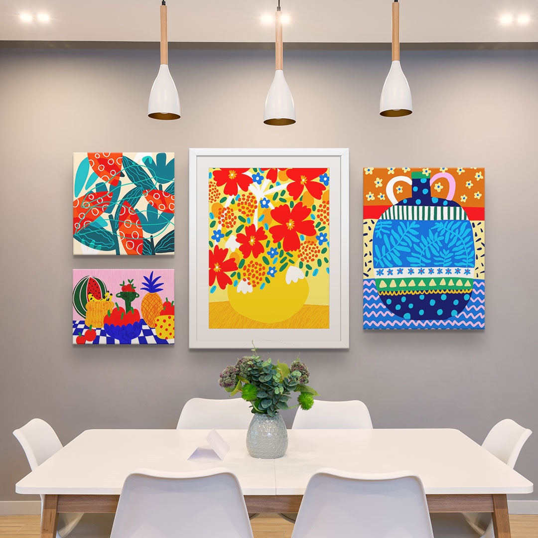 A gallery wall in a dining room of four colorful canvas prints from teresa rego