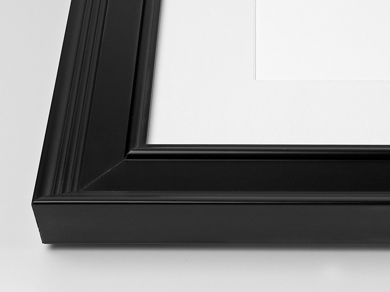 Close-up view of the corner of an art print with a Glenwood black frame