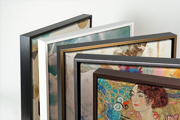 five canvases with floating frames as viewed from above, each with a different frame option