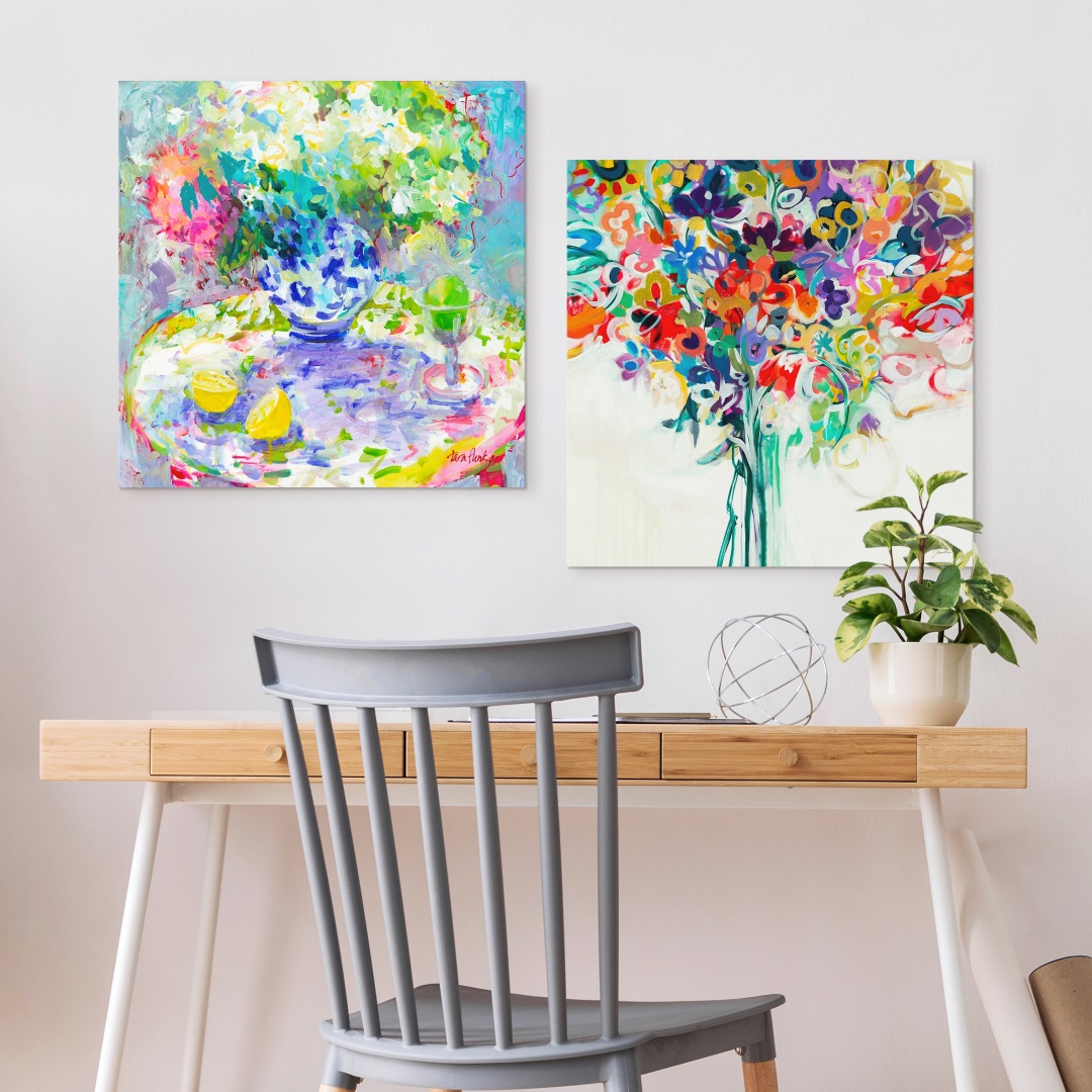 two vibrant floral contemporary canvas prints hung over a home office desk