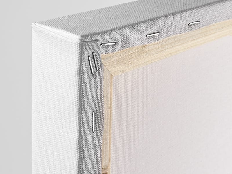 Close-up view of a stretched canvas corner from the back