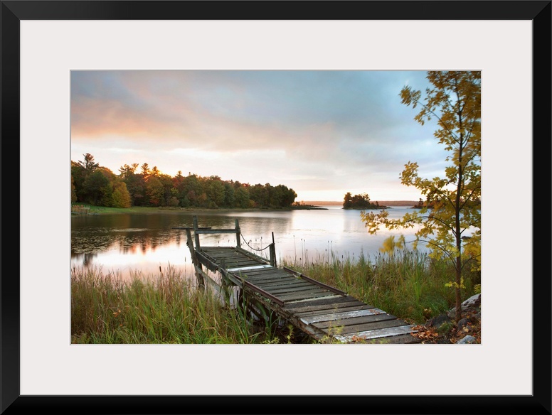 A Dock On A Lake At Sunrise Near Wawa; Ontario, Canada
