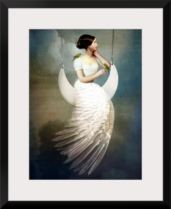 A conceptual portrait of a female with a feather dress sitting on a moon swing.