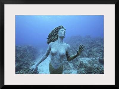 Cayman Islands, Grand Cayman Island, mermaid sculpture in shallow coral reef