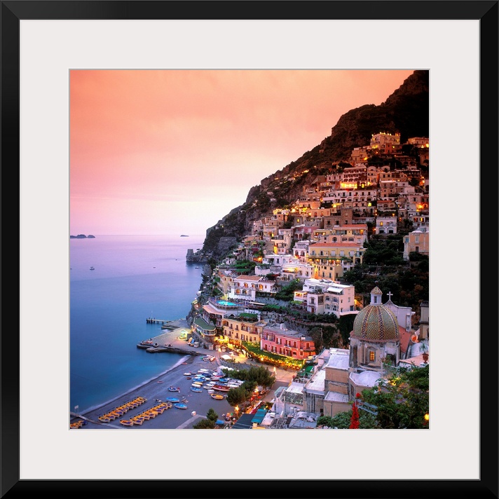 A square shaped photograph of the charming Italian town of Positano at sunset. Built into the cliffs overlooking the Medit...