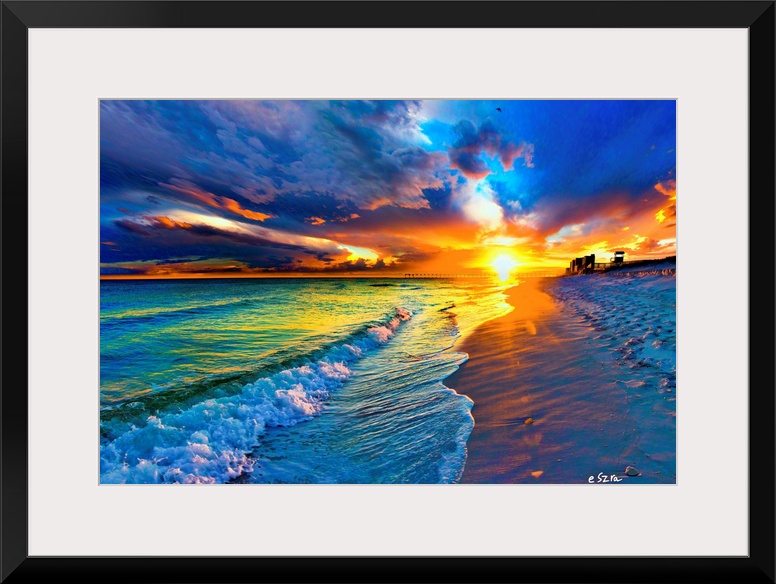 Blue sea under a yellow sun burst at sunset.