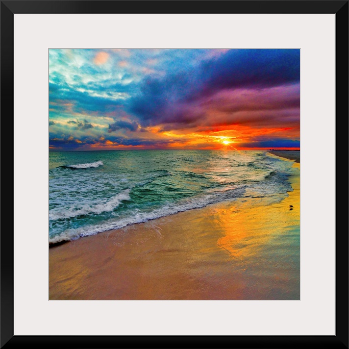 A square image of the sun descending over the ocean amid bright, technicolor clouds.