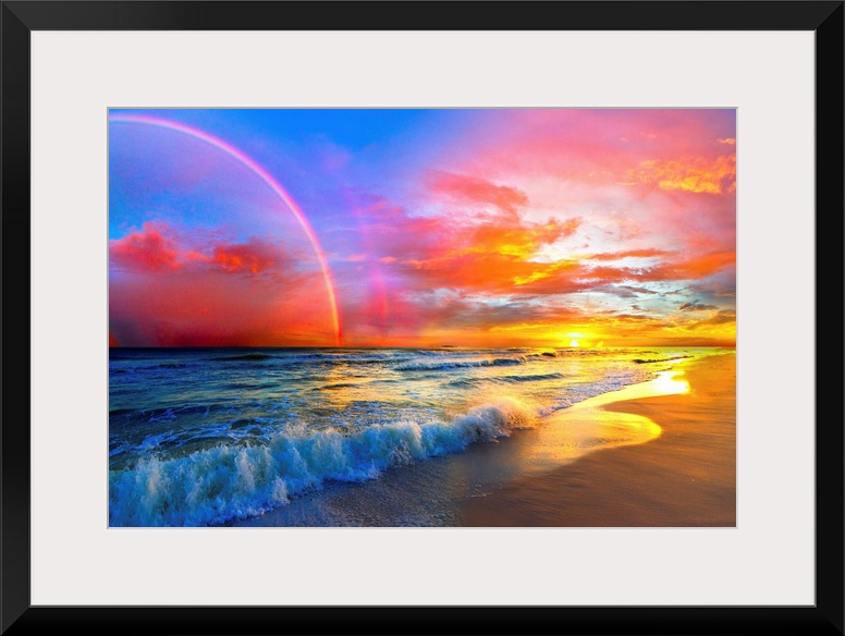 A beautiful colorful pink rainbow and sunset over ocean waves of a sandy beach. The colors and light of the beautiful suns...