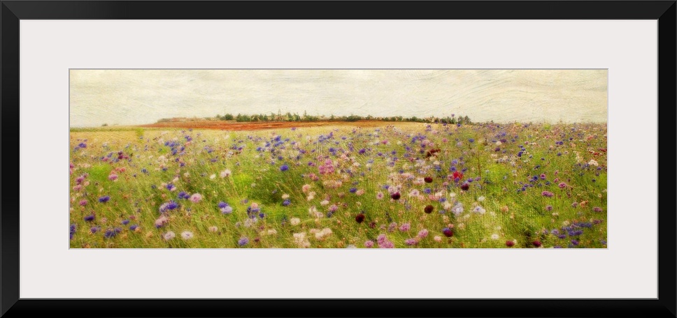 A colorful field of painted wildflowers beneath a clear, open sky on a large, horizontal wall hanging.