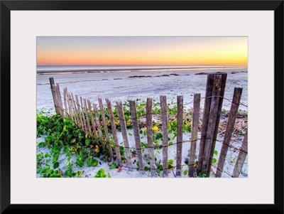 A beach fence at sunset on Hilton Head Island, South Carolina.