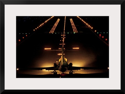 Airplane on runway at night