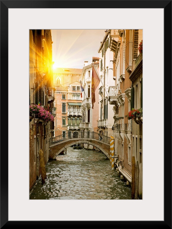Large portrait wall hanging of buildings and a bridge in a canal in Venice, Italy.