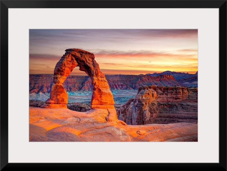 This wall art for the home or office shows desert rock cliffs growing in the light of a sunset.