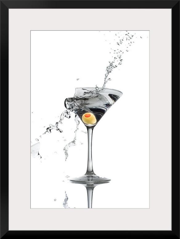 A shattering martini glass on a white background spraying liquid outward.