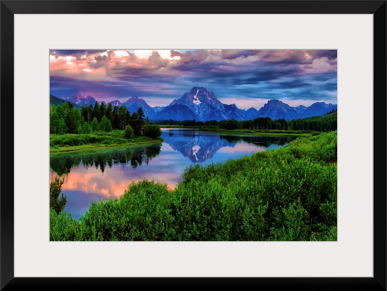 Giant, landscape photograph of morning light breaking through a stormy cloud cover over the Snake River, at Oxbow Bend in ...