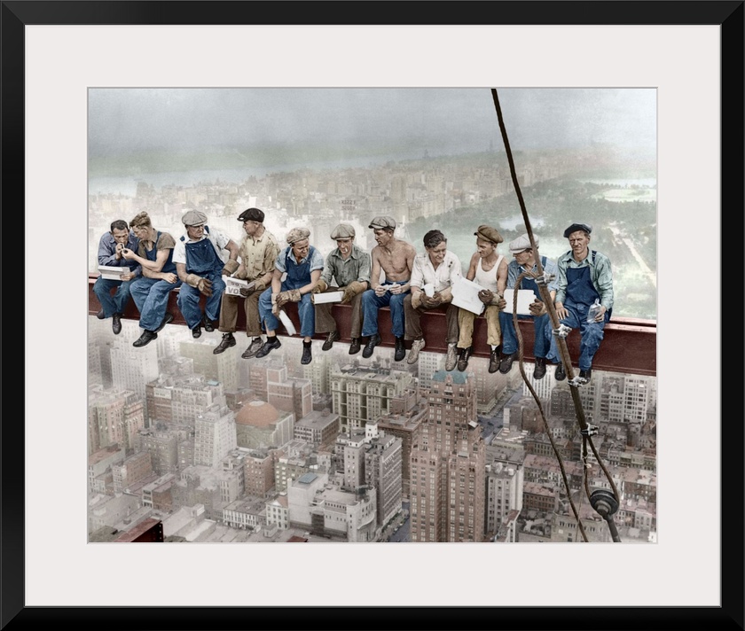 29 Sep 1932, Manhattan, New York City, New York State, USA --- Construction workers eat their lunches atop a steel beam 80...